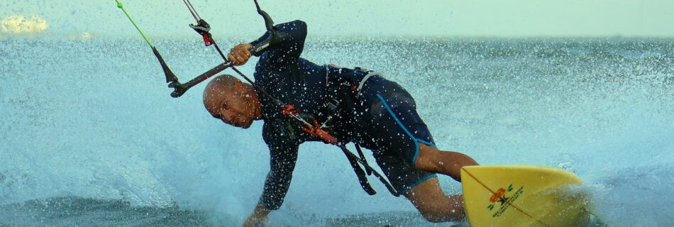 photo of man kite surfing