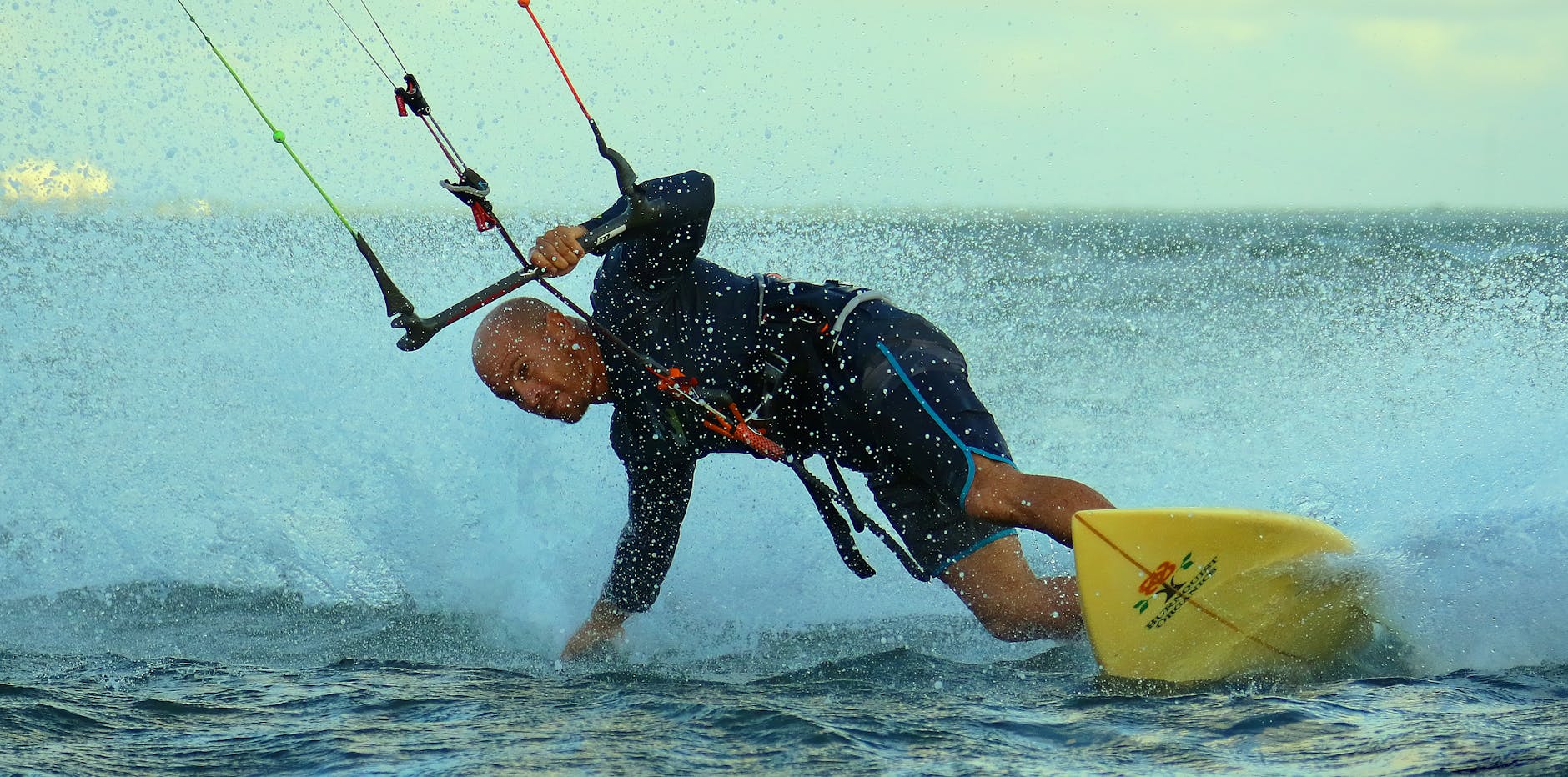 photo of man kite surfing