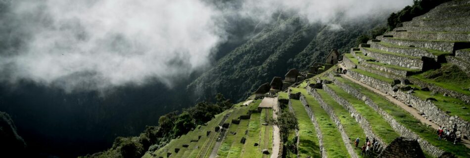 tourists on terraced fields in the lost city of the incas