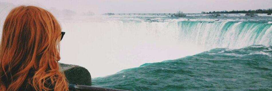 woman standing near of niagara falls