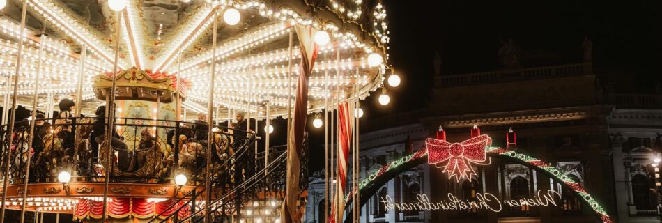 festive night at a christmas market with carousel