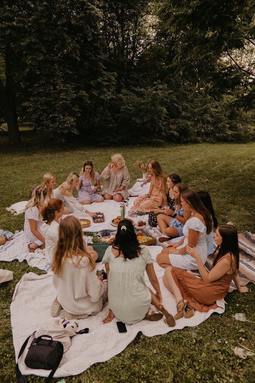 group of women having a picnic in a park