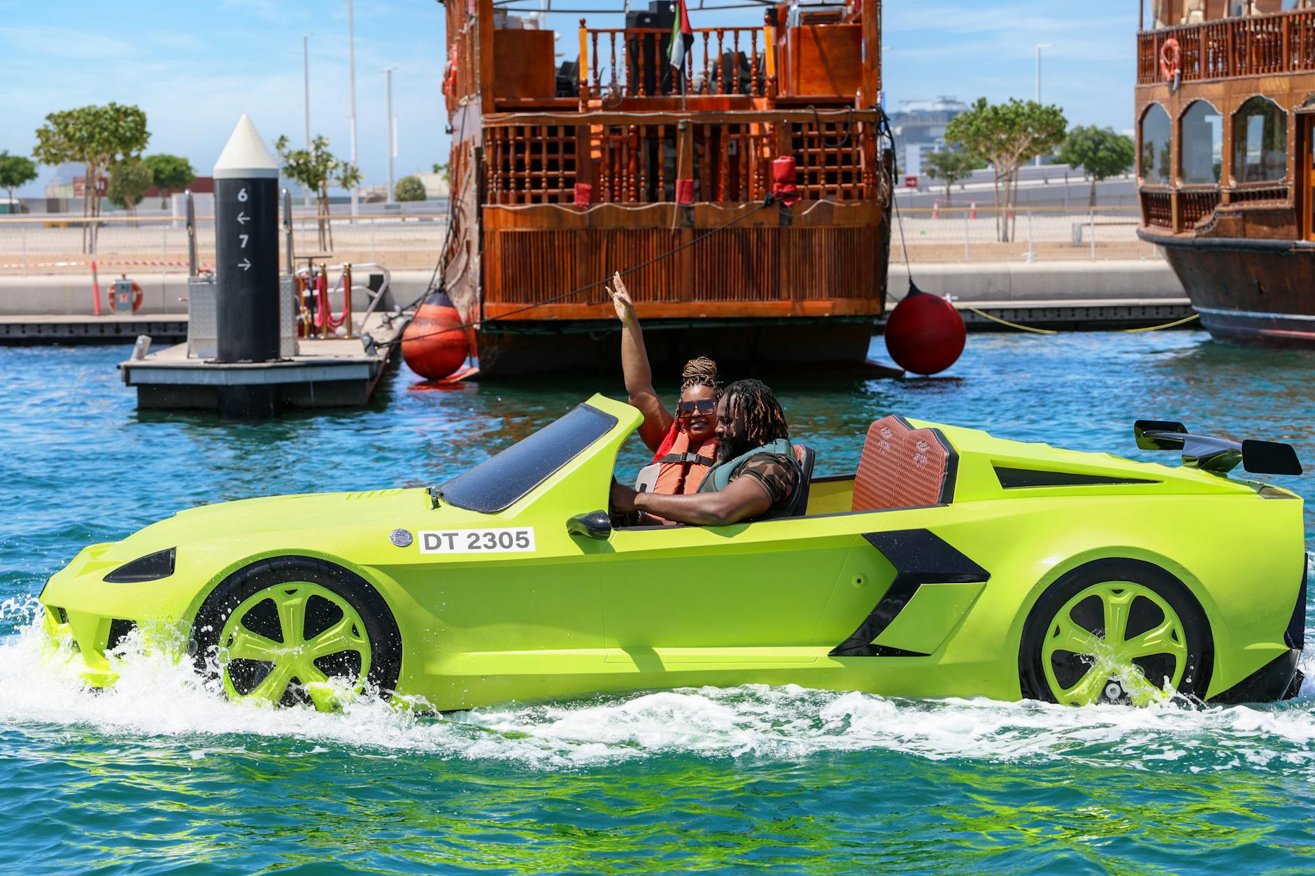 couple in amphibious cabriolet