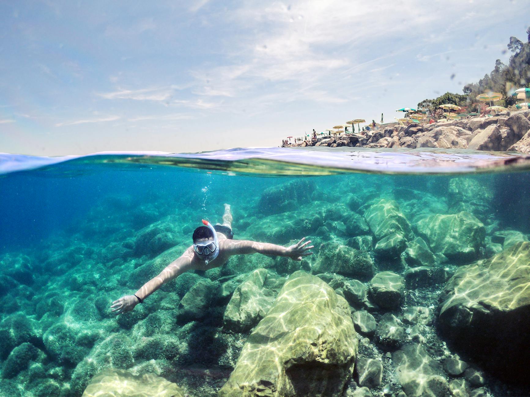 a man using snorkel under the water