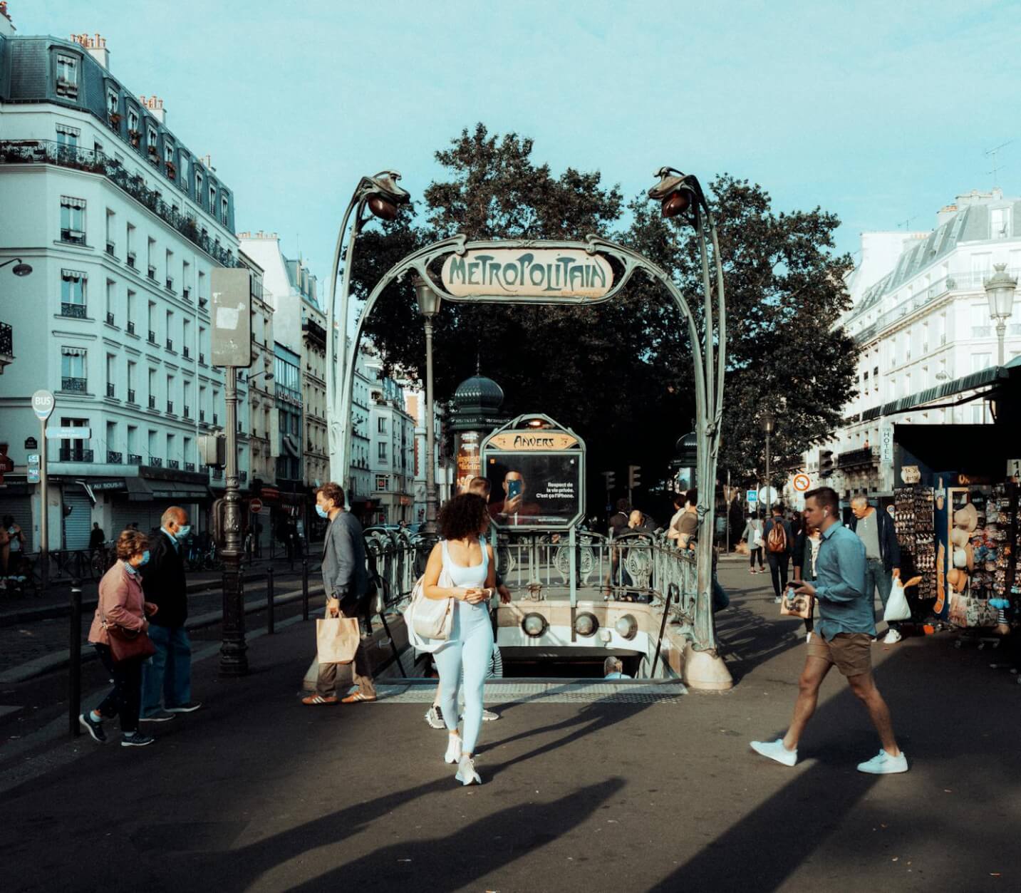 paris metro entrance with pedestrians