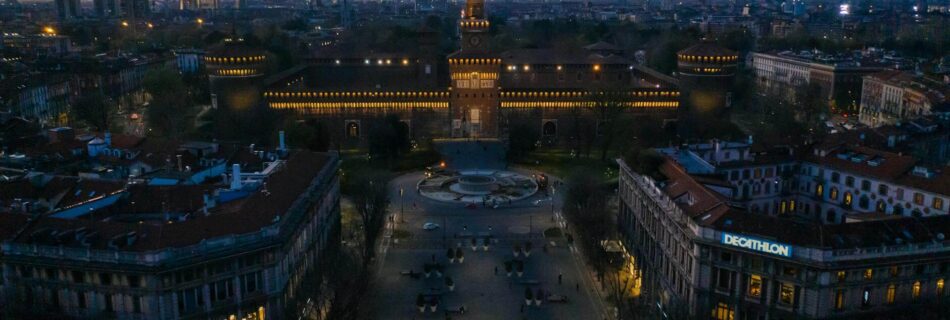 illuminated castello sforzesco medieval fortification in milan in the evening