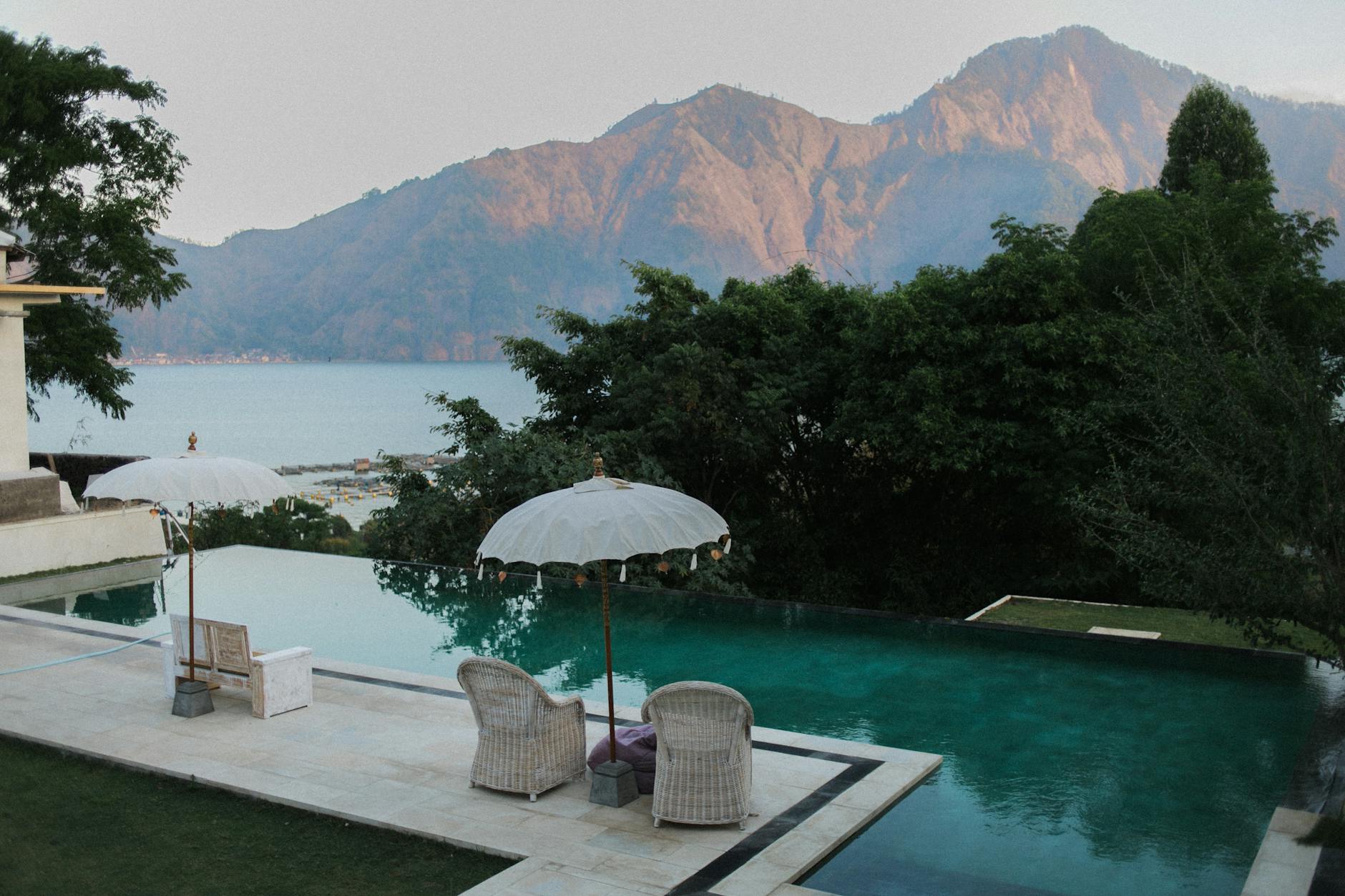 calm resort terrace with pool against mountains